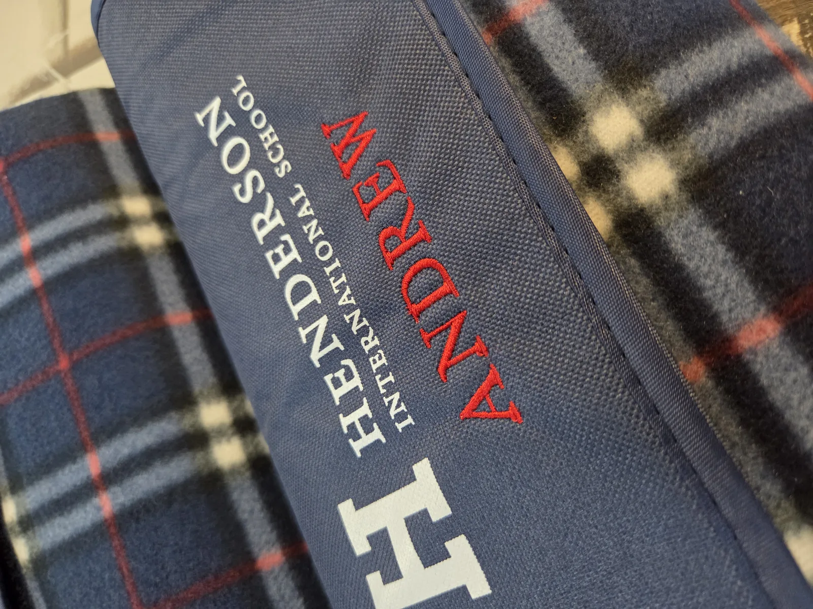 Custom embroidered blanket for Henderson International School