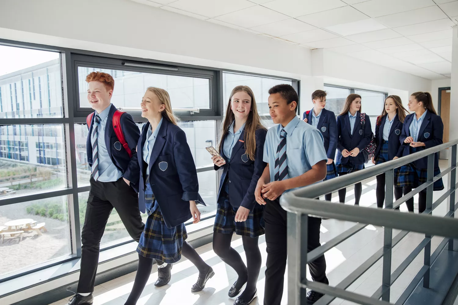 Students in custom school spirit wear and uniforms